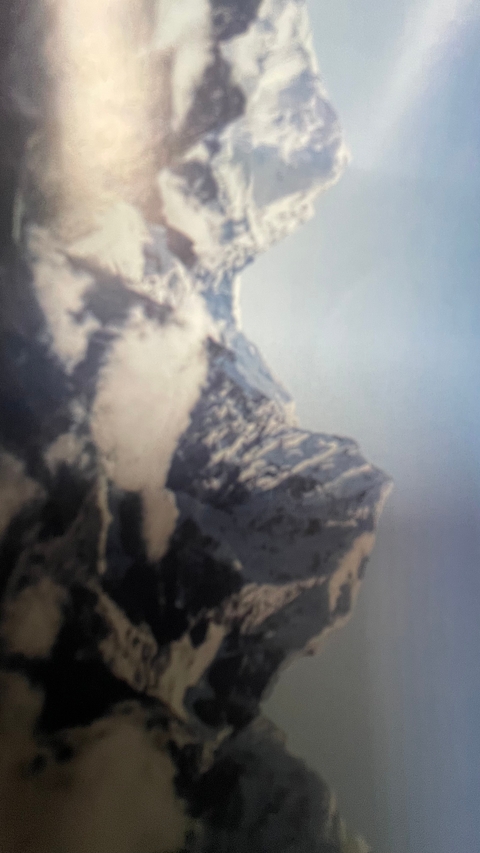       Blurry image of a mountainous landscape.
  