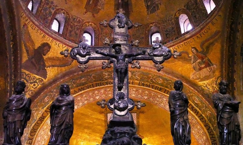       Ornate religious interior with statues and frescoes.
  