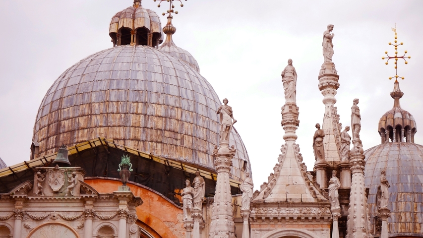       Dome of St. Mark's Basilica with ornate sculptures.
  