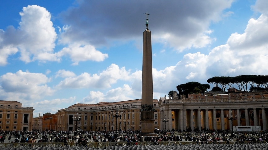       Obelisk in the center of a crowded public square.
  