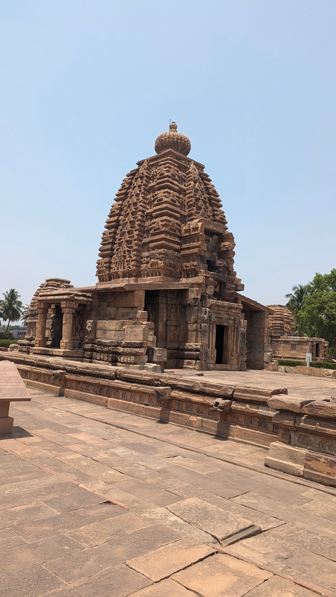       Intricate stone temple structure with decorative carvings.
  