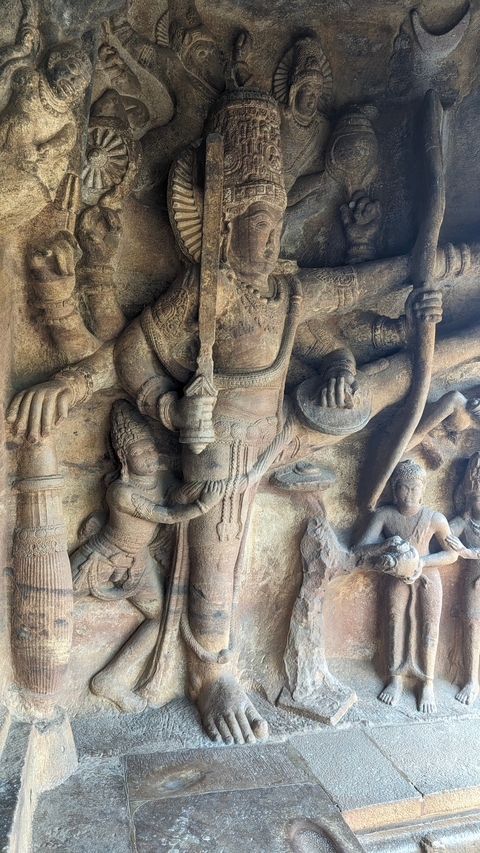       Ancient stone sculptures depicting Hindu deities with intricate carvings.
  