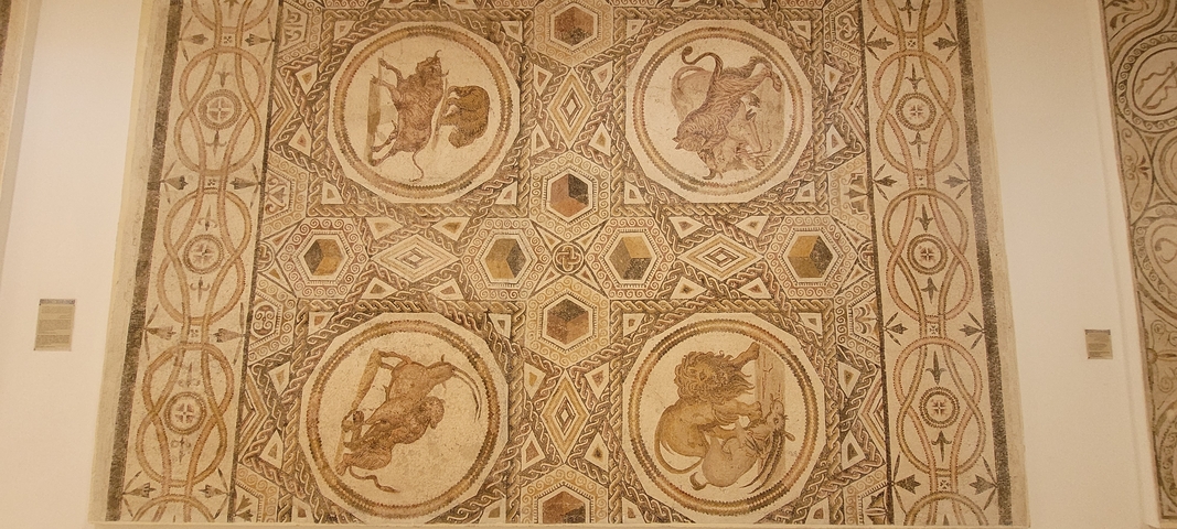       A detailed mosaic artwork with animal patterns.
  