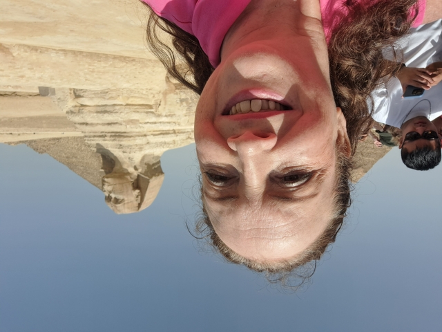 A person posing near the Great Sphinx of Giza.