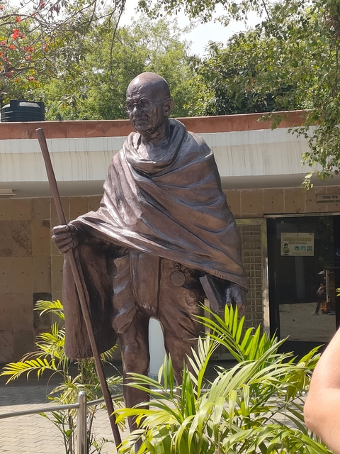 Statue of a robed figure holding a staff.