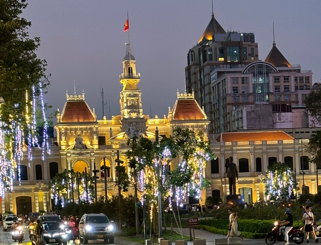 Illuminated colonial building in a city at night.