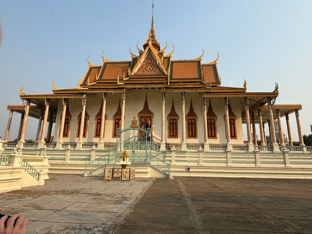 Ornate temple with a central fountain surrounded by columns.