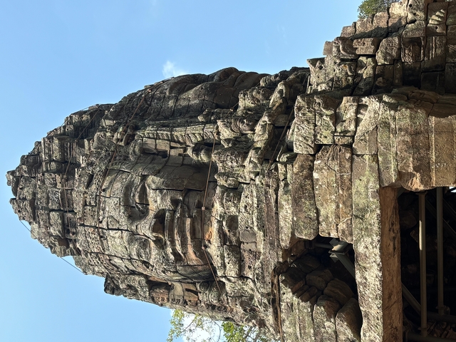       Close-up of ancient stone carvings on temple ruins.
  