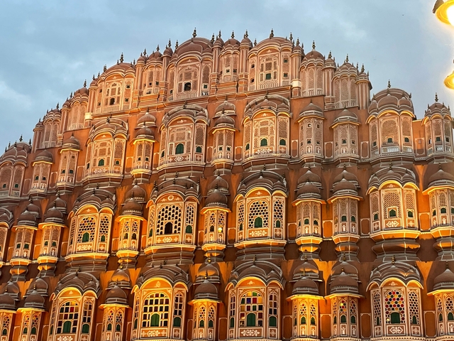       Illuminated facade of a historic building.
  