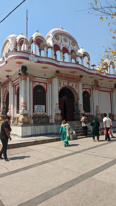 Colorful temple with people entering.