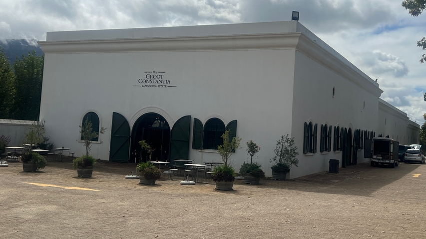       Exterior of a winery building with green shutters.
  