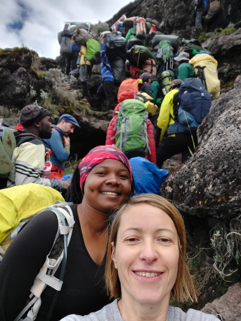       A group of hikers climbing a rocky path.
  