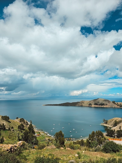 Scenic view of a lake with clouds overhead.