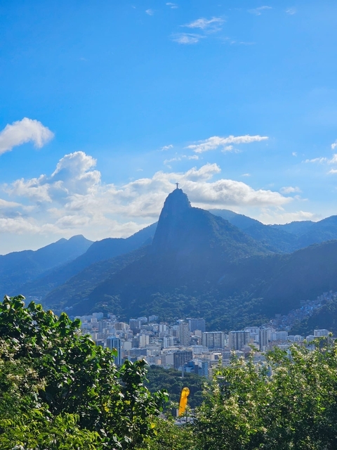 Silhouette of a mountain with a famous landmark at the summit.