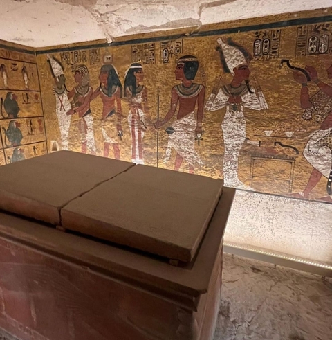 Close-up of ancient Egyptian wall art and sarcophagus.