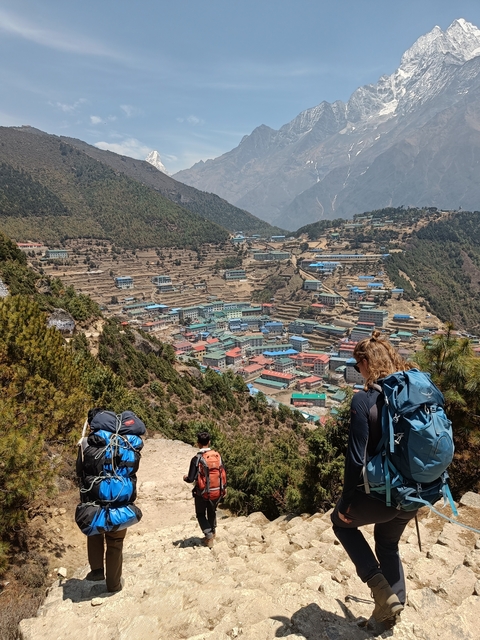       A view over a colorful village in a mountainous landscape.
  