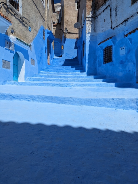 Blue street with stairs in Chefchaouen.