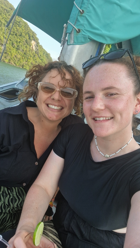 Two women smiling for a selfie.