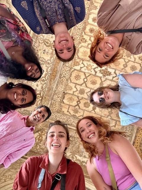 Group looking up at a decorated ceiling.