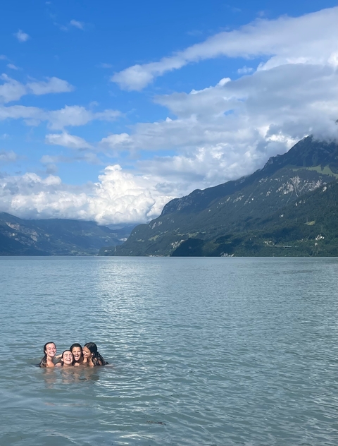 Beautiful lake surrounded by mountains under a clear sky.