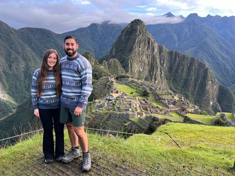 Couple posing in front of Machu Picchu.