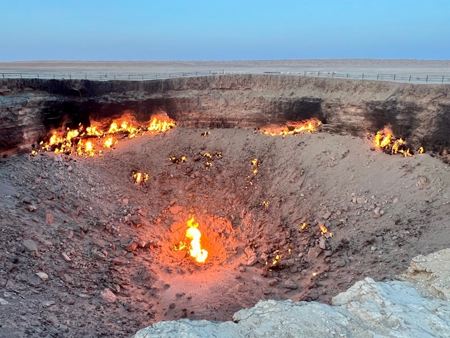       Fiery crater set against a barren landscape.
  