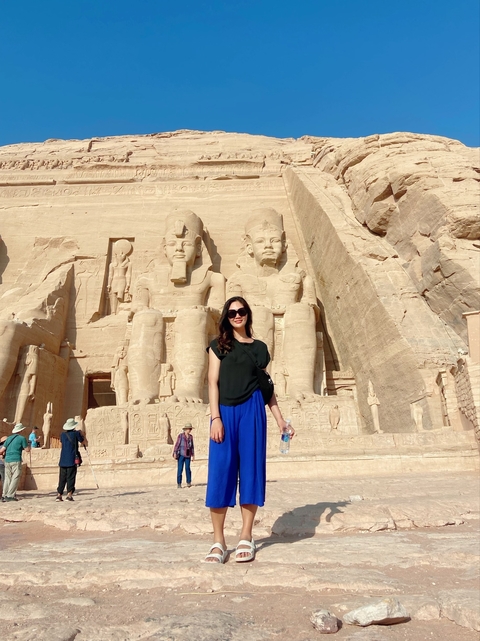 Person in front of the large statues of Abu Simbel.