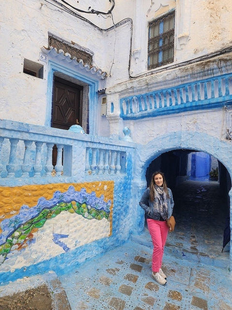       Tourist in the blue city of Chefchaouen.
  