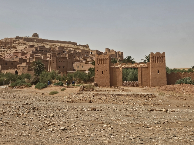 Historic fortification structures in a desert landscape.