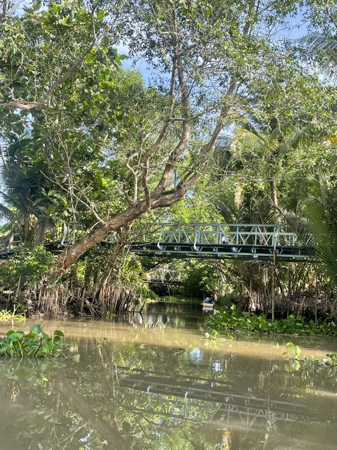 Scenic view of a bridge surrounded by dense vegetation.
