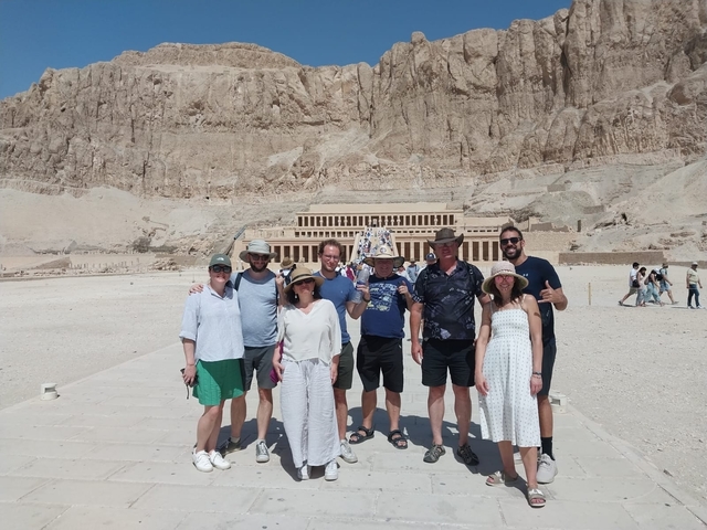       Group of tourists in front of the Hatshepsut Temple in Egypt.
  