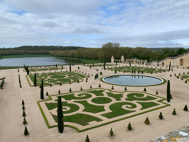 Ornate garden with ponds and hedges at Versailles.