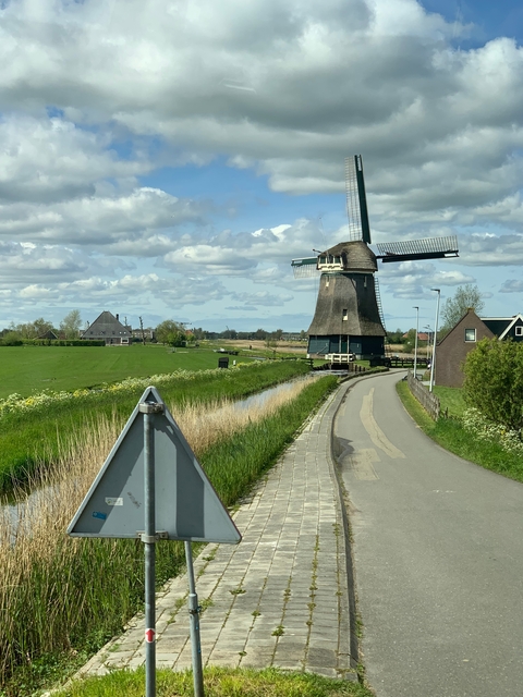 Traditional Dutch windmill in the countryside.