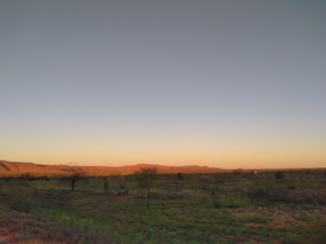       Blurry landscape at sunset.
  