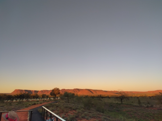       Blurry landscape at sunrise or sunset.
  