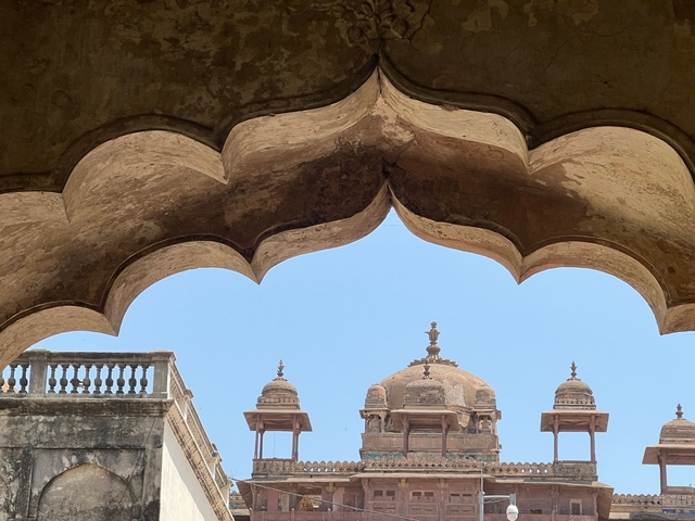 Architectural detail of a domed structure against the sky.