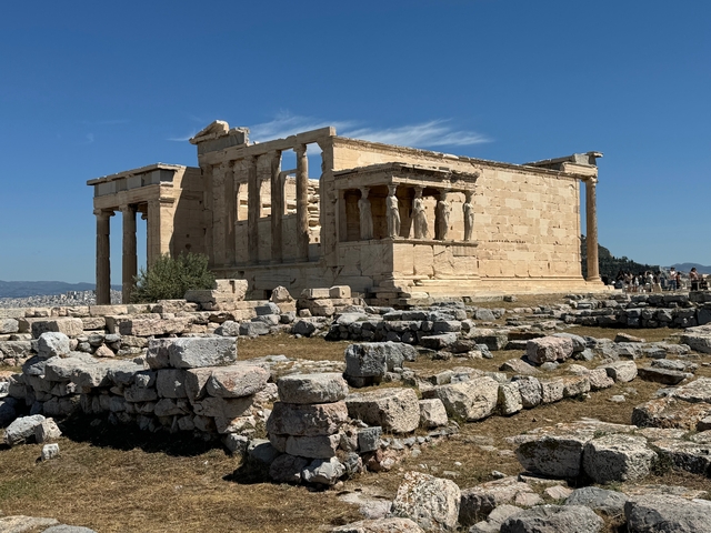       Ruins of an ancient temple with columns.
  