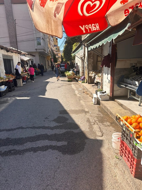 Street market with various vendors.