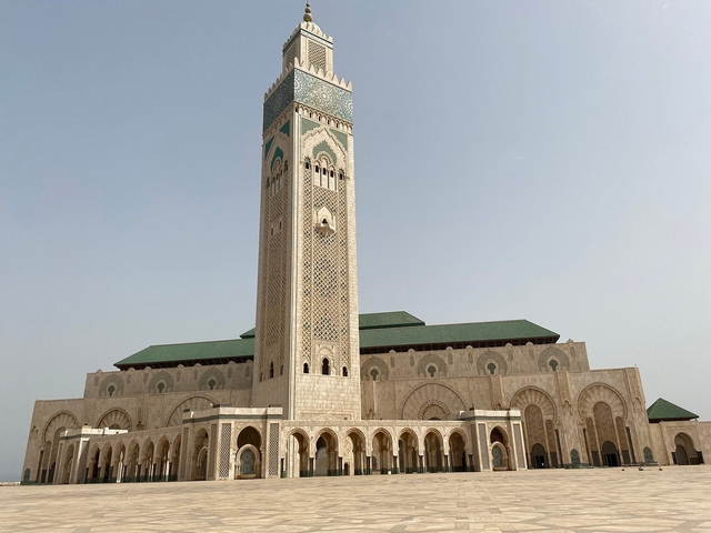 Large mosque with towering minaret.