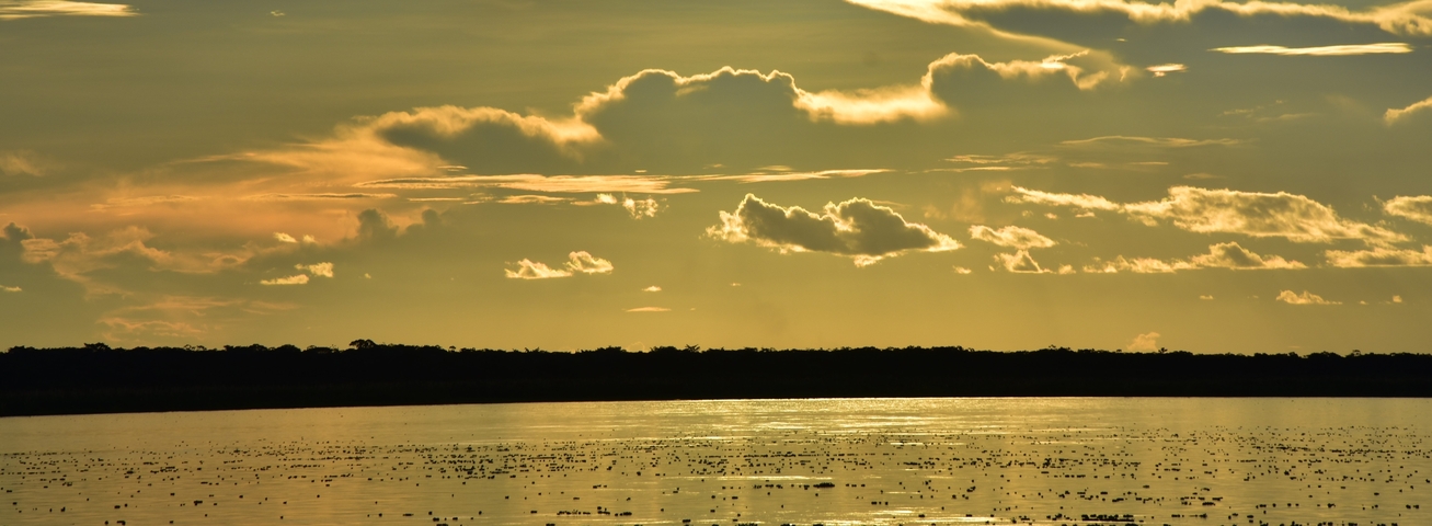 Scenic view of a sunset over a calm body of water.