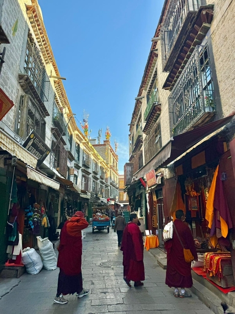 Bustling market street with traditional architecture.
