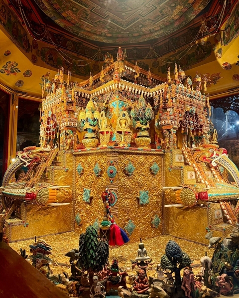 Ornately decorated golden structure with intricate designs.