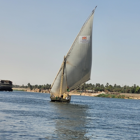 Traditional sailboat (felucca) sailing on the river.