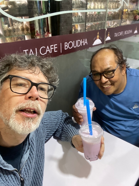 Two people enjoying drinks in a casual setting.