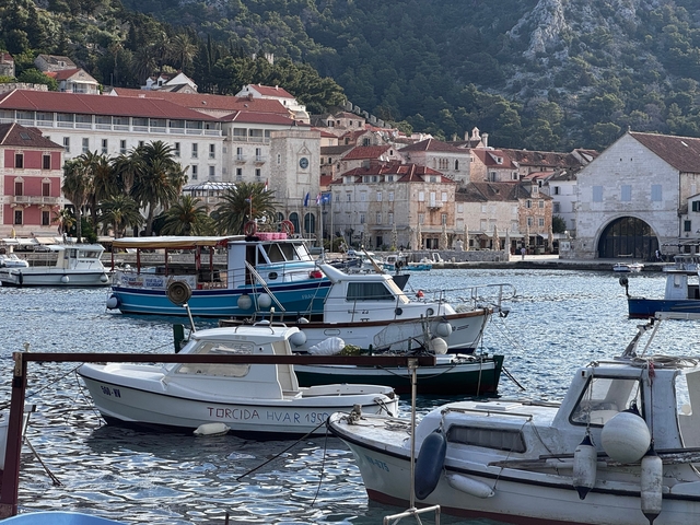 Scenic view of a coastal town with boats in the harbor.