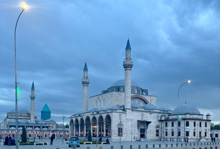 Mosque with multiple domes and minarets.