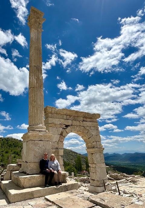       Ancient ruins with a clear blue sky above.
  