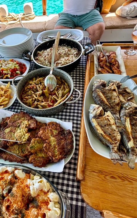       A variety of traditional food dishes on a table.
  