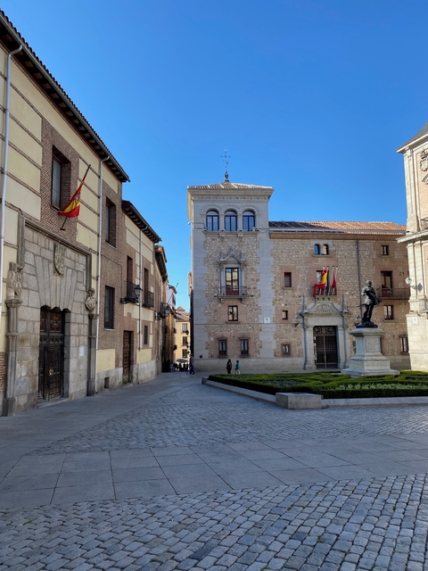 Quaint street in Madrid with historical buildings.