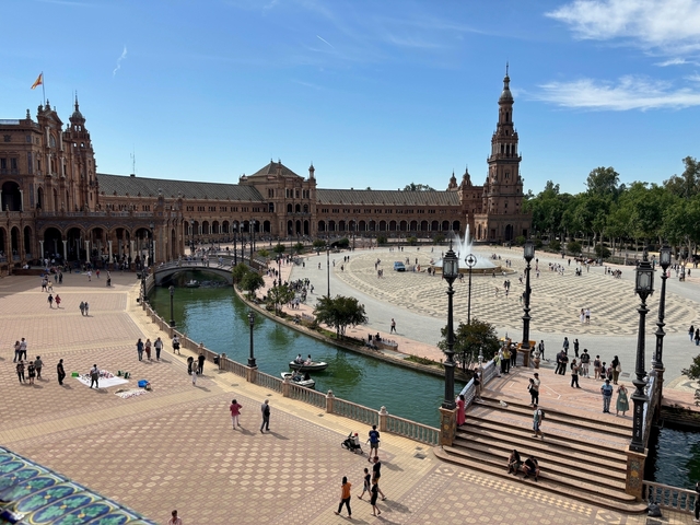 Plaza de España in Seville bustling with people.